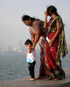 Photograph of a family on the Marine Drive seawall, Mumbai, India