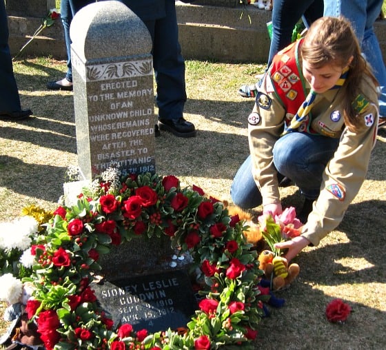 Placing flowers on the grave of the Unknown Child, Halifax, April 15, 2012