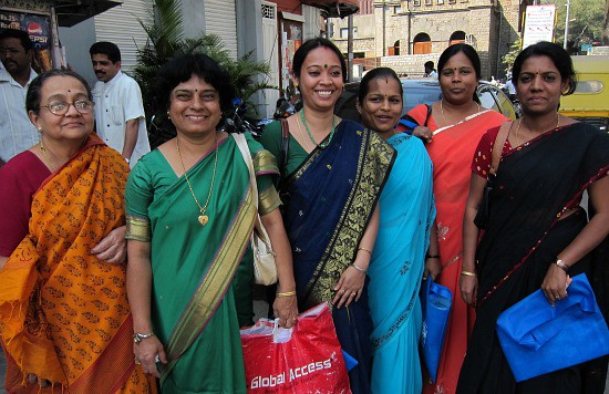 Photograph of the women of India, in saris, shopping in Bangalore