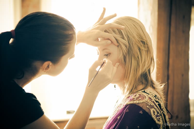 Photograph of Olga Kirnos applying makeup by Andrew Adams of Katha Images