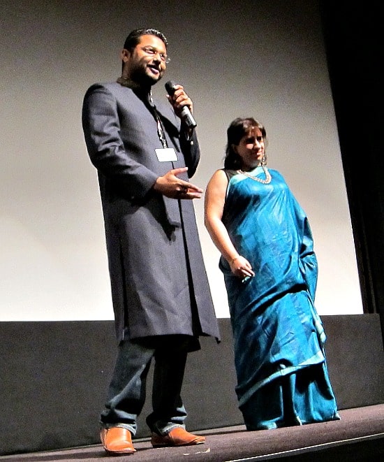 Photograph of Rubhir Dasgupta and Guneet Monga on stage at TIFF for Michael