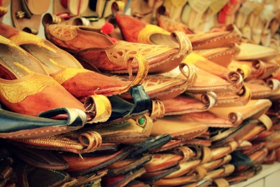 Shoes are popular with tourists and shoppers in Janpath, Delhi, India