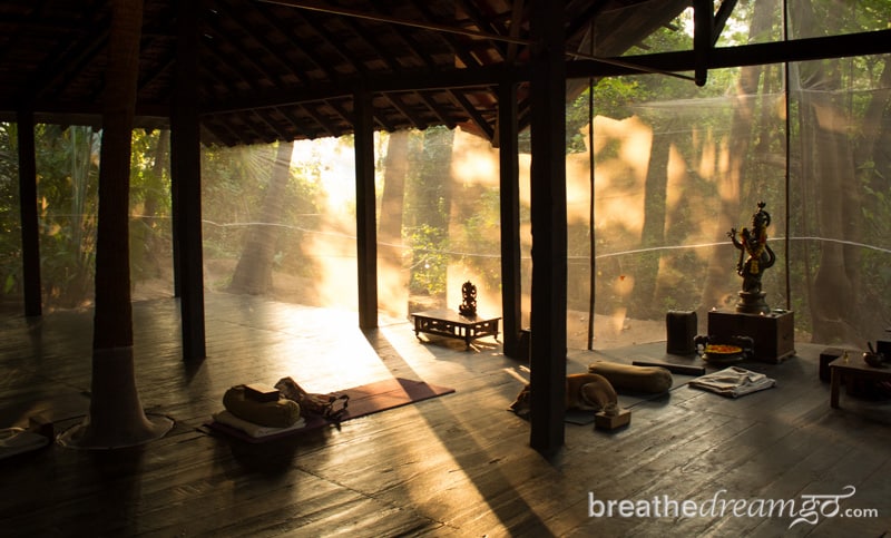 Sun streaming into wood building in Goa