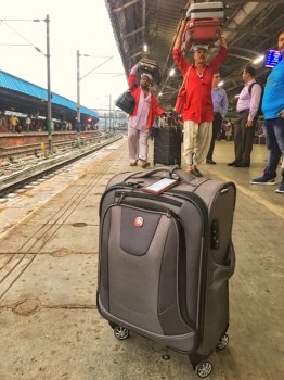 Luggage and porters on Indian railway platform