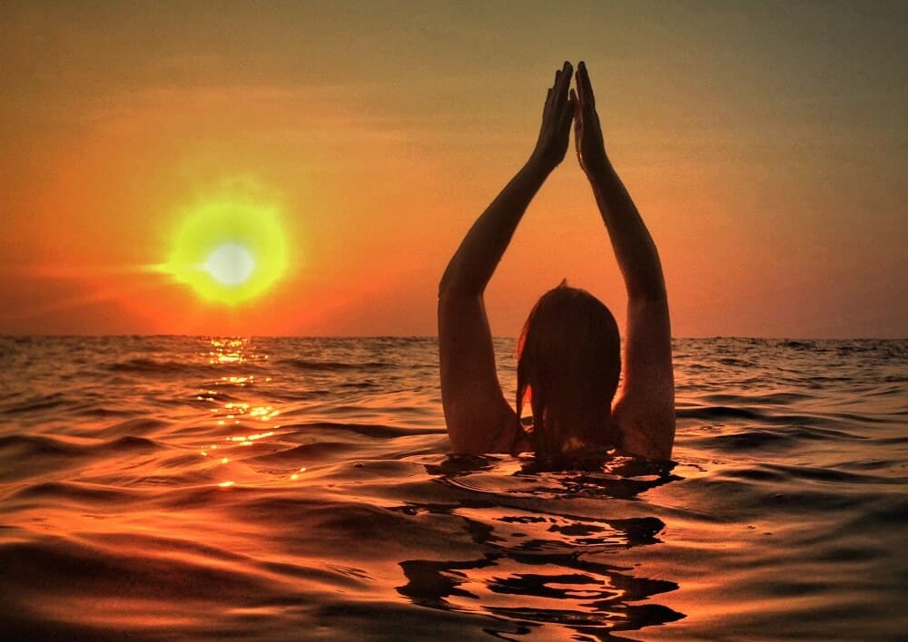 Mariellen Yoga pose in the ocean