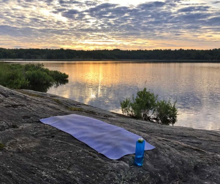 Responsible travel products: water bottle and yoga mat
