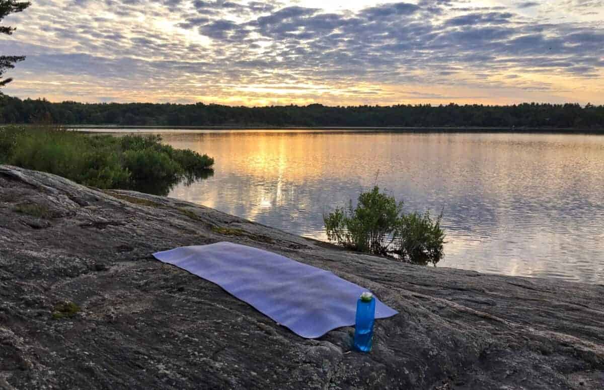 Responsible travel products: water bottle and yoga mat