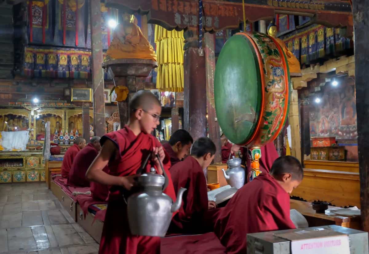 Buddhist monks in temple in Ladakh