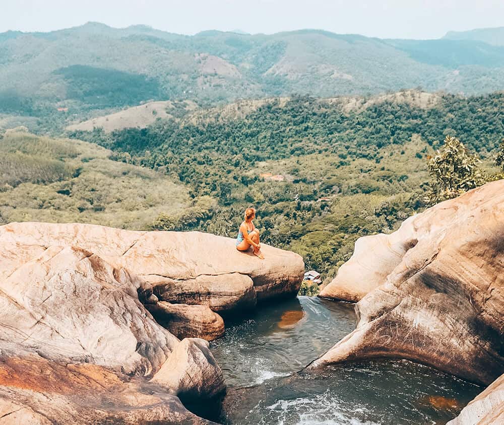 girl on rock at Diyaluma Falls Sri Lanka