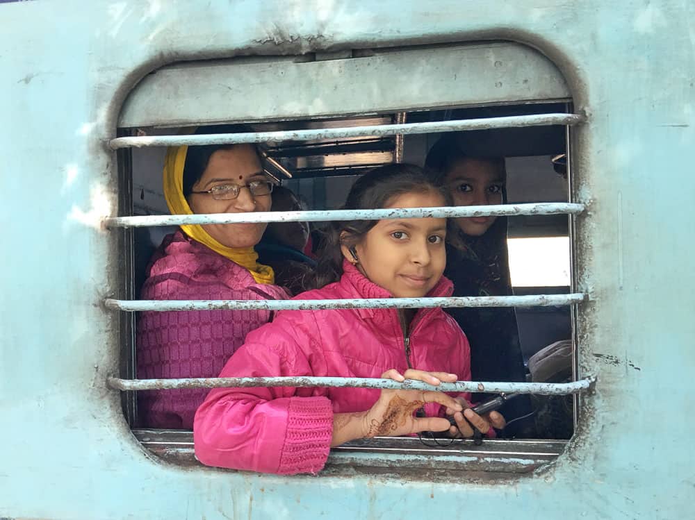 girl in window of Indian train