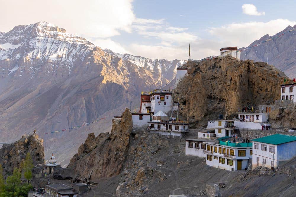 buildings on hillside with view of mointains