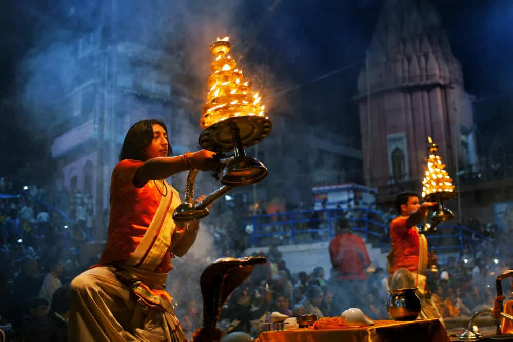 prayer ritual of Ganga Aarti in Varanasi with lights and fire