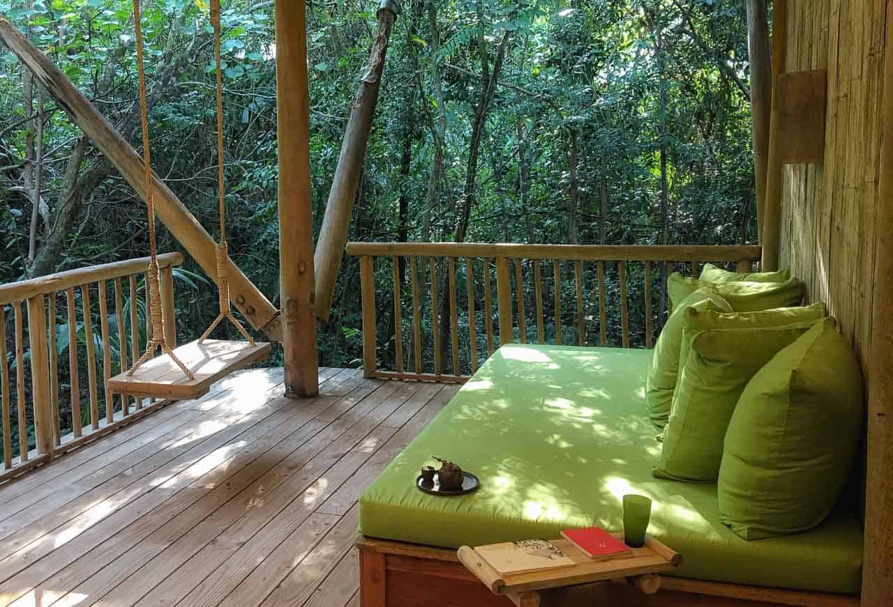 sofa and chair swing at Soneva Kiri, Thailand resort