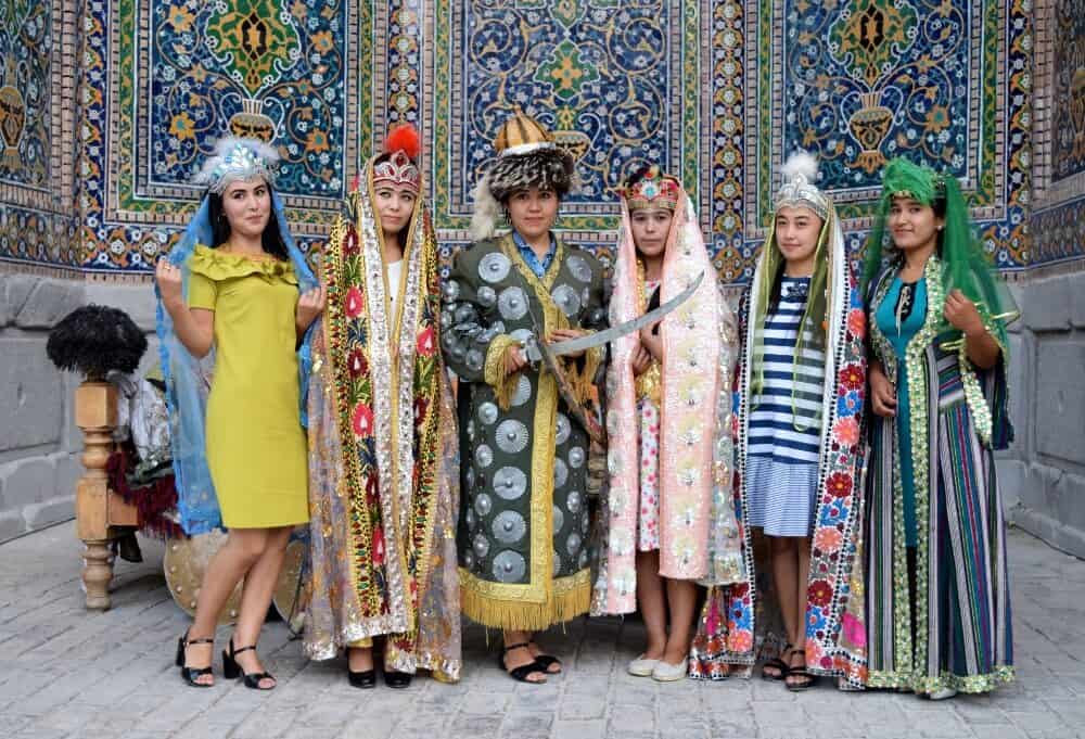 Girls posing in traditional dress at The Registan, Samarkand, Uzbekistan