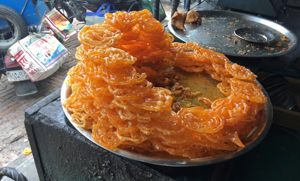 a pile of jalebis at a street stall in India