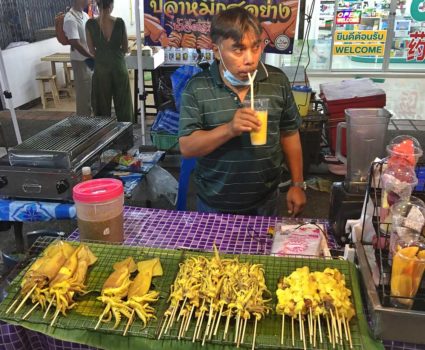 a Thai food stall selling grilled fish