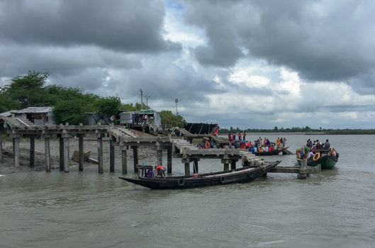 boats at a jetty on the river in Sunderbans