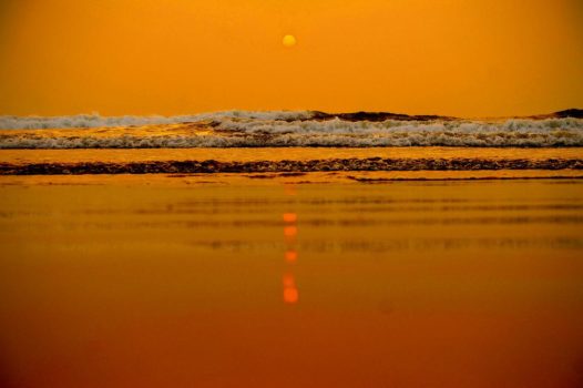 Orange sunset on a beach in Goa