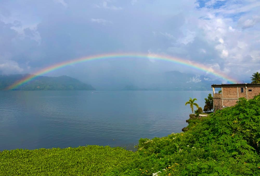 Monsoon rainbow in Sumatra, Indonesia