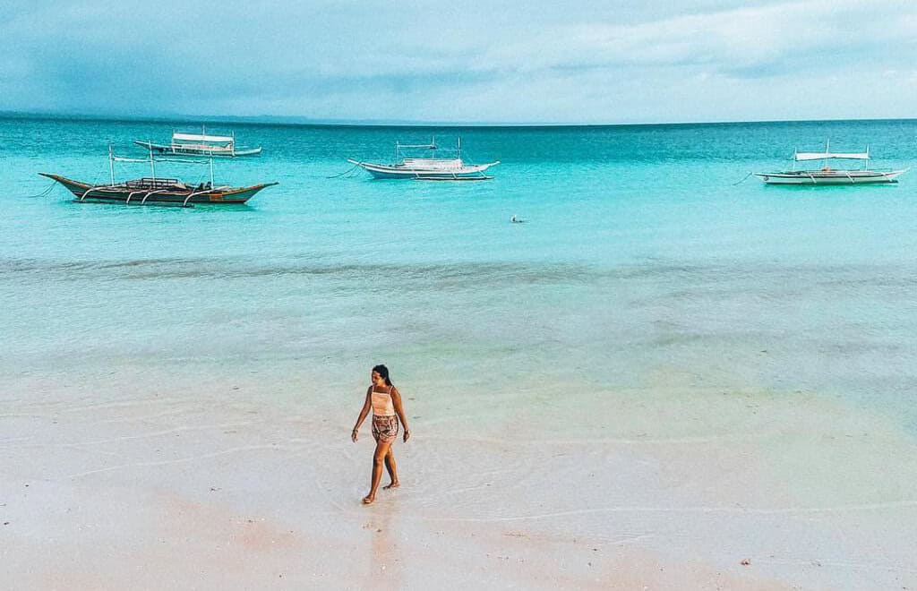 Beach and clear turquoise water of Bantayan Island, Philippines.